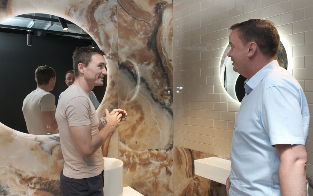 Hotel Designs editor Hamish Kilburn in conversation with CTD Tiles specifiaction manager Paul Sewell in the CTD Architectural Tiles showroom
